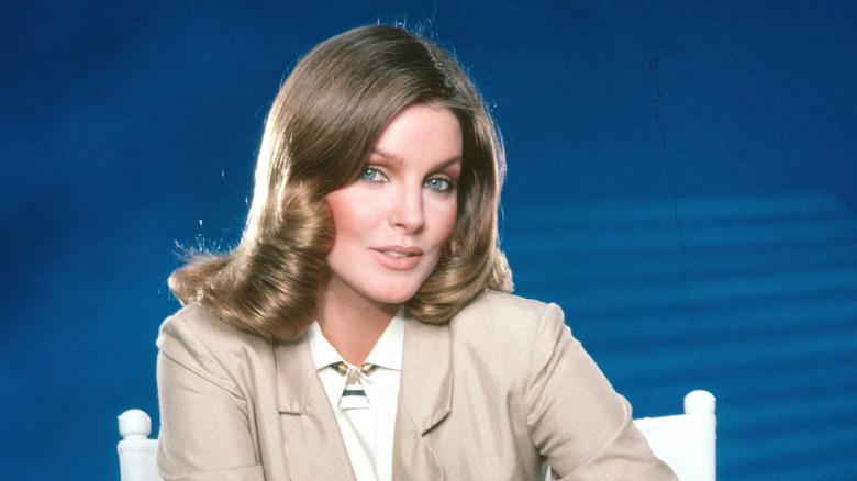 Priscilla Presley smiling and staring at the camera