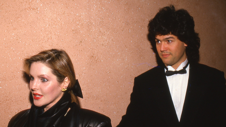 (l-r): Priscilla Presley and Marco Garibaldi walking at an event