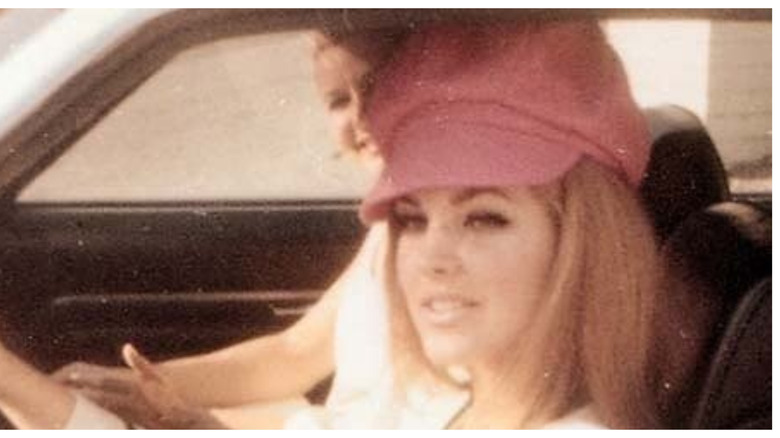 (l-r): Priscilla Presley driving a friend in her car.
