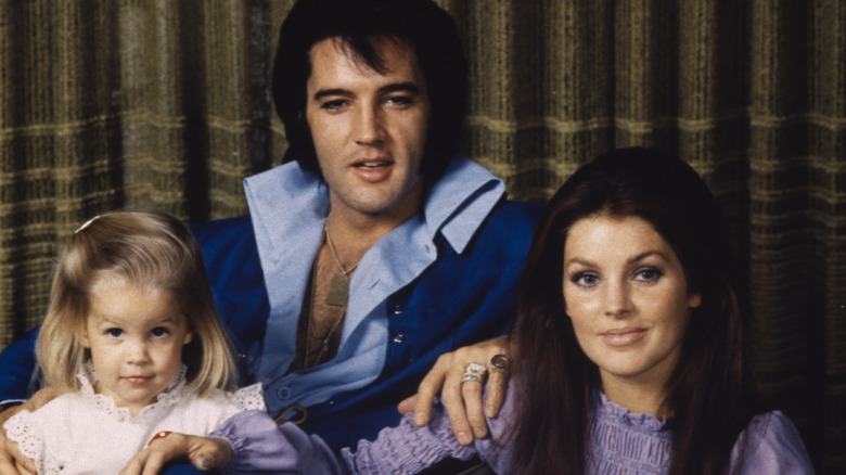 Family picture of Elvis, Priscilla, and Lisa Marie Presley