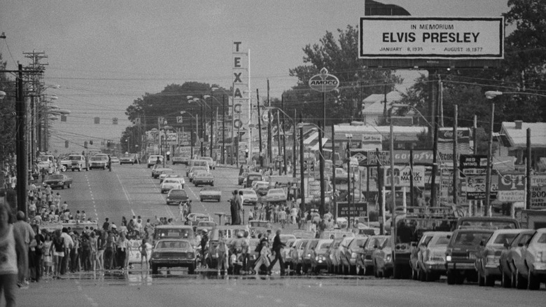 Crowds and cars line the streets at Elvis Presley's funeral in Memphis, Tennessee