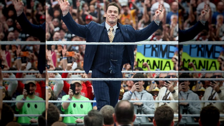 John Cena wearing a suit inside a wrestling ring