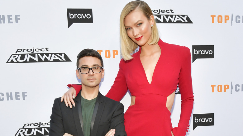 Christian Siriano and Karlie Kloss posing together at Bravo event