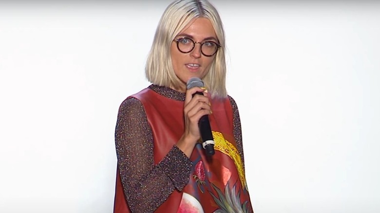 Erin Robertson speaking into a microphone