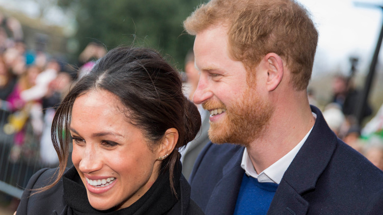 Meghan Markle and Prince Harry posing