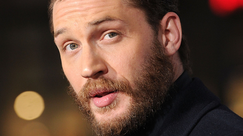 Tom Hardy looks surprised on the red carpet
