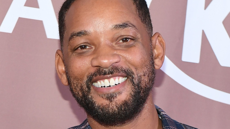 Will Smith smiling on the red carpet