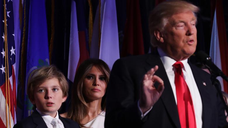 Barron and Melania trump behind Donald Trump