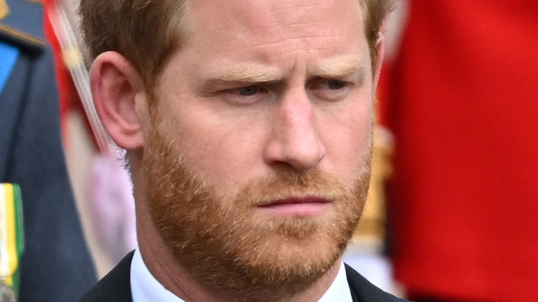 Prince Harry frowning