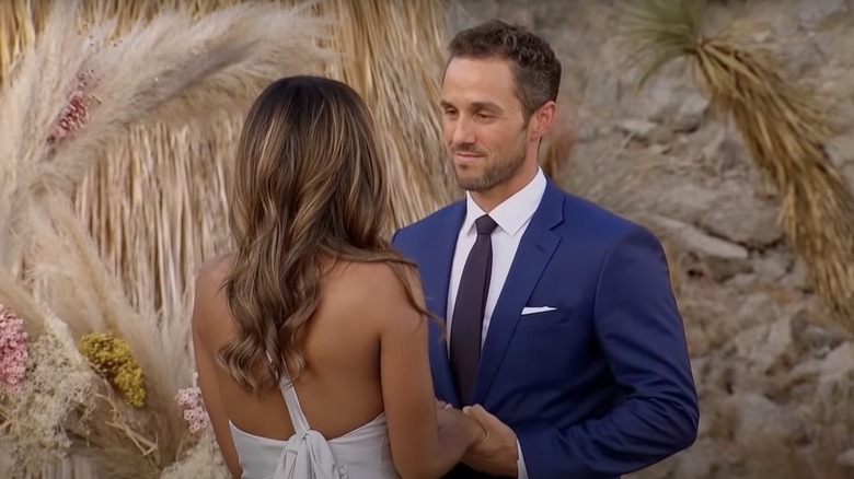 Zac Clark looking deep into Tayshia Adams' eyes