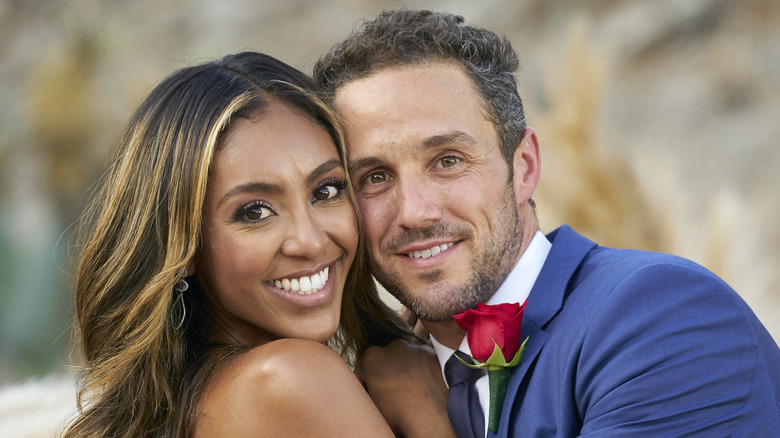 Zac Clark and Tayshia Adams embracing