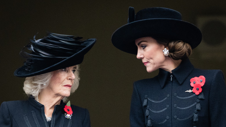 Queen Camilla talking to Princess Kate