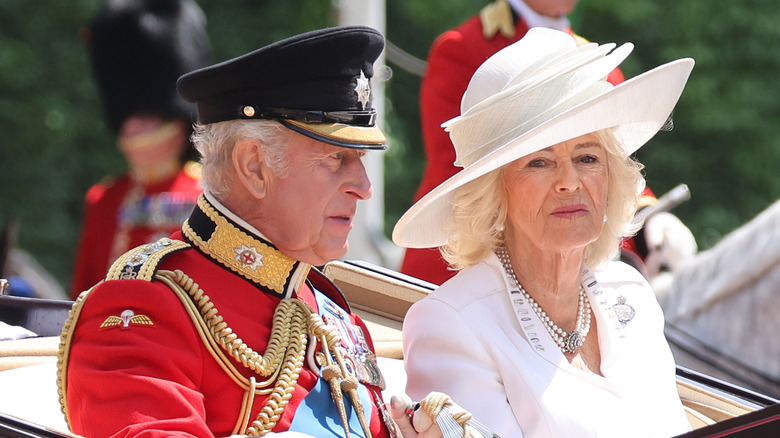 King Charles and Queen Camilla riding in carriage at Trooping the Colour 2025