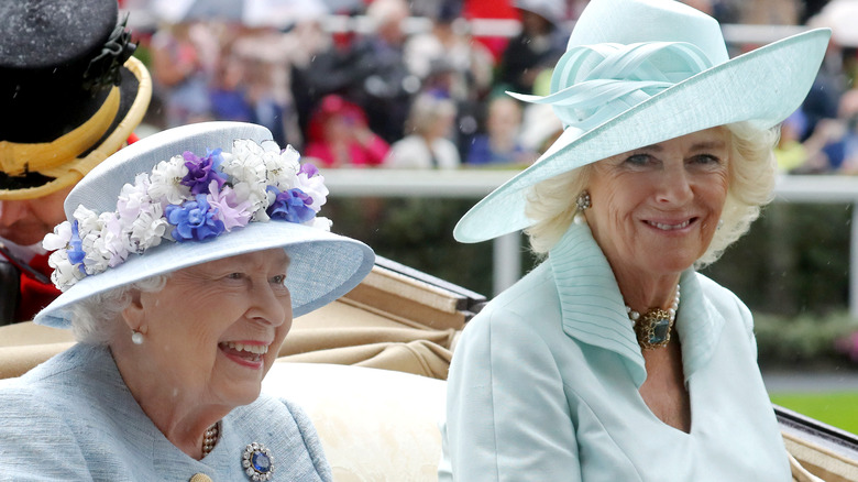 Queen consort Camilla and Queen Elizabeth smiling