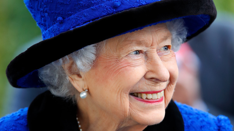 Queen Elizabeth II in blue hat