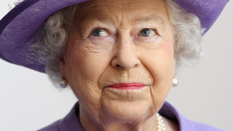 Queen Elizabeth in purple hat