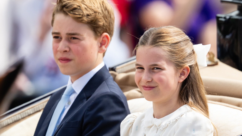 Prince George and Princess Charlotte riding in a carriage together