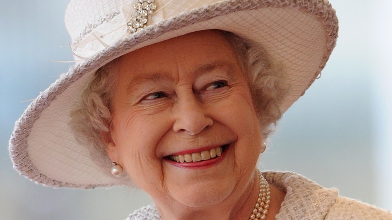 Queen Elizabeth white hat smiling