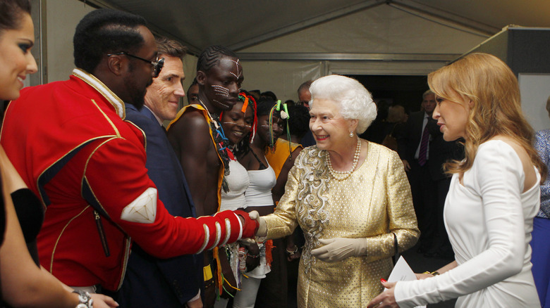 Queen Elizabeth being introduced to Will.i.am by Kylie Minogue at the Diamond Jubilee