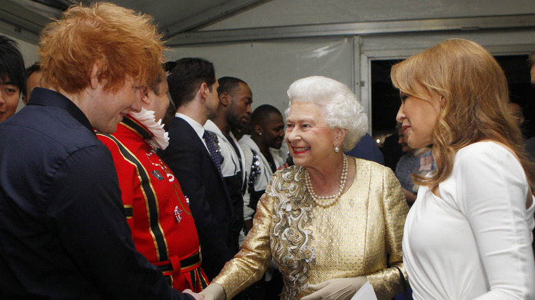 Queen Elizabeth II being introduced to Ed Sheeran by Kylie Minogue at the Diamond Jubilee