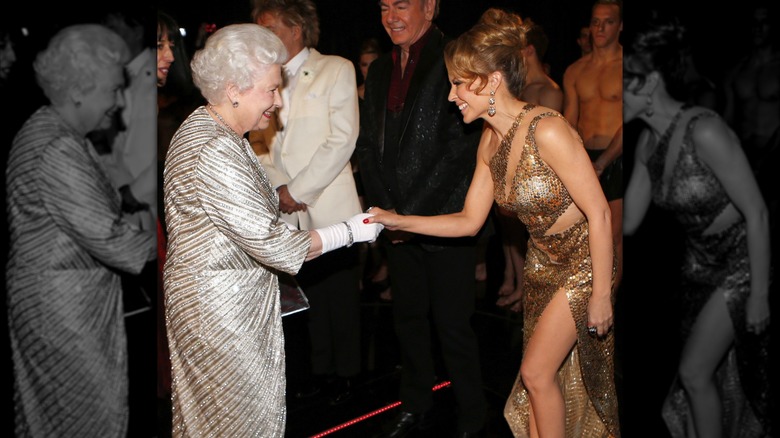 Queen Elizabeth II greeting Kylie Minogue in 2012