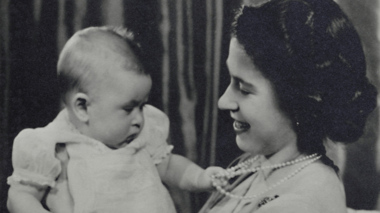 the future king Charles as a tot with his mom, the future queen