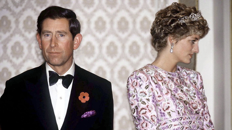 King Charles and Princess Diana on their last outing together in South Korea, facing away from eachother