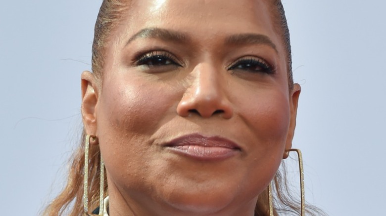 Queen Latifah semi-smiling