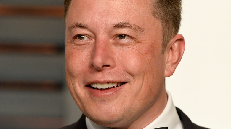 Elon Musk smiling at an event