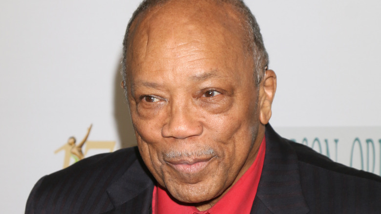 Quincy Jones piercing his lips