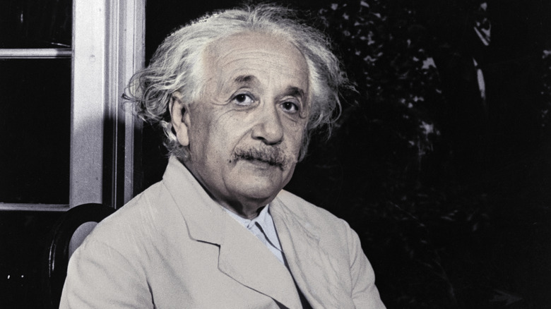 Albert Einstein smiling at the camera