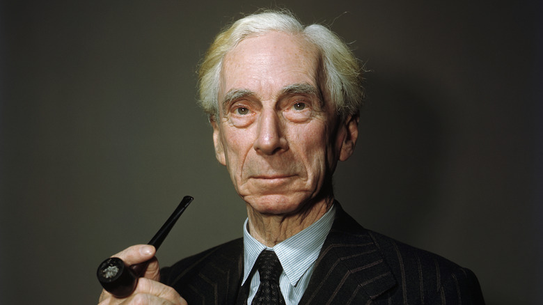 Bertrand Russell smiling with a pipe