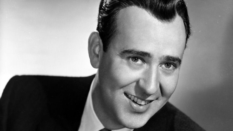 Carl Reiner smiling in a black and white photograph