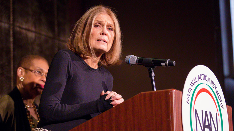 Gloria Steinem speaking at podium
