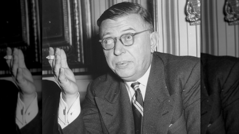 Jean-Paul Sartre talking and gesturing with a cigarette