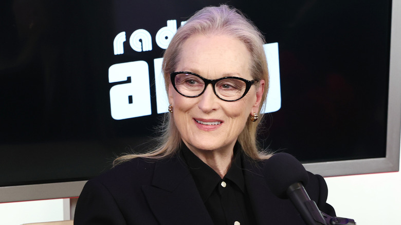 Meryl Streep smiling with microphone