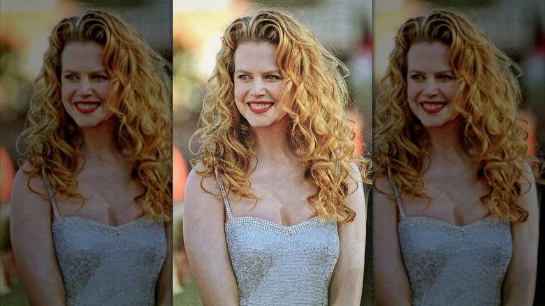 Nicole Kidman curly red hair down, red lip, silver gown in the '90s