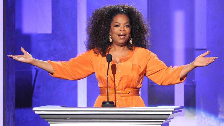 Oprah Winfrey talking and holding out her hands