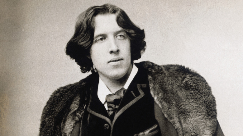 Oscar Wilde posing for a photo