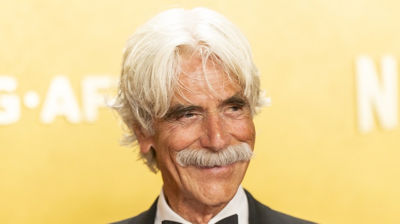 Sam Elliott with a mustache looking to his left.