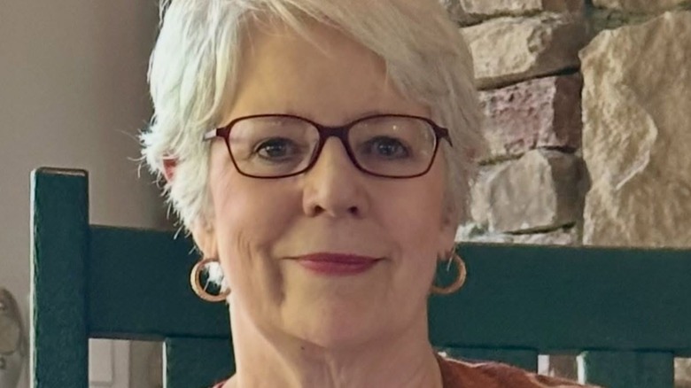 Sue Monk Kidd on green chair