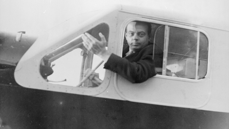 Antoine de Saint-Exupéry piloting a plane