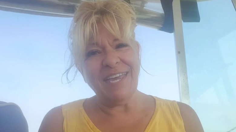 Antonella Nester smiling in a yellow sleeveless top.