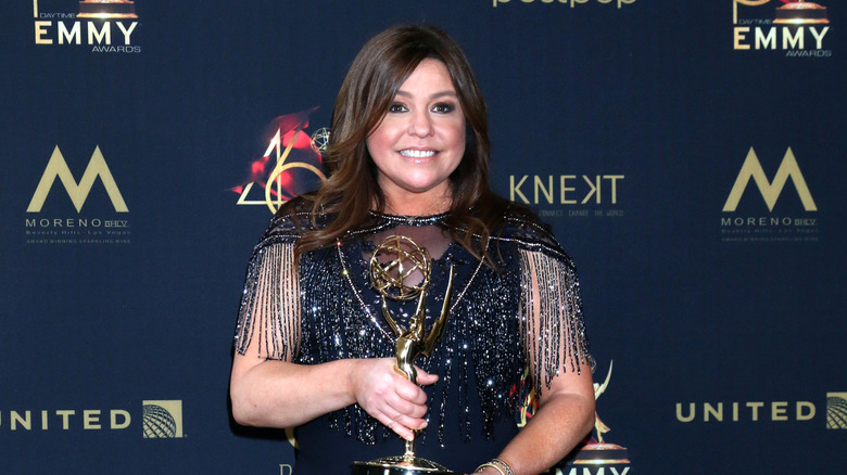 Rachael Ray holding a Daytime Emmy on the red carpet in 2019