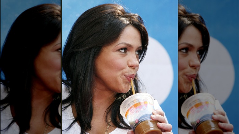 Rachael Ray drinking a Dunkin' coffee