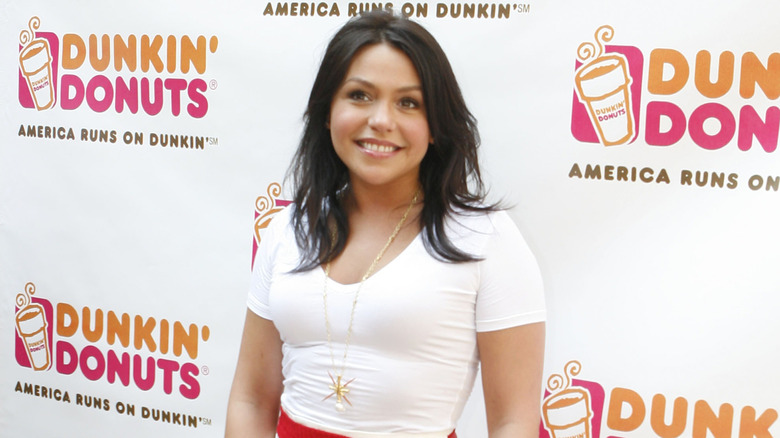 Rachael Ray posing on Dunkin' Donuts step-and-repeat
