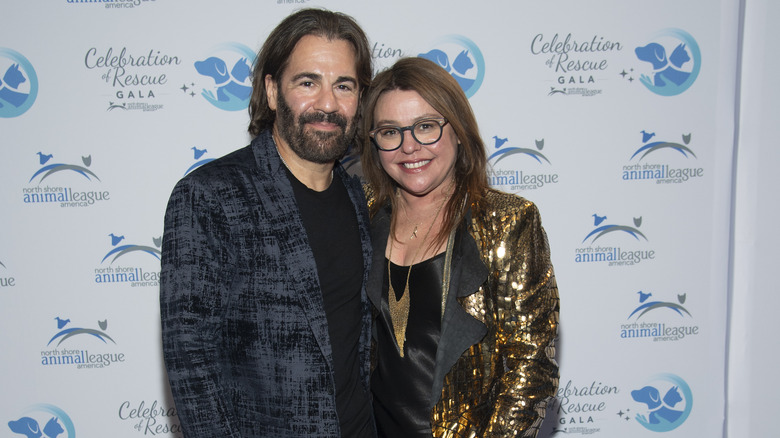 Rachael Ray posing on the red carpet with her husband, John Cusimano