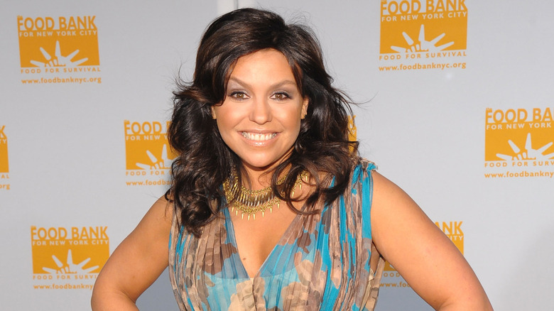 Rachael Ray smiling on step-and-repeat