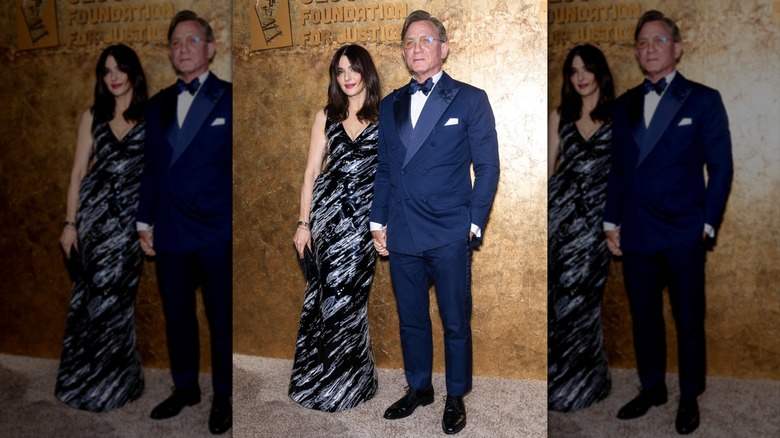 Rachel Weisz and Daniel Craig posing together on the red carpet in their finery