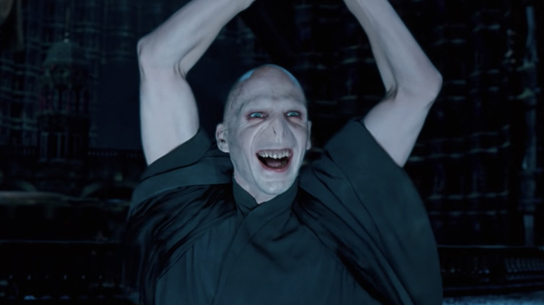 Ralph Fiennes smiling as Voldemort in Harry Potter